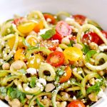 This spiralizer Greek salad is a light and refreshing side dish made with cucumbers, tomatoes, basil, chickpeas, feta cheese and balsamic vinaigrette. So easy and delicious! | APinchOfHealthy.com