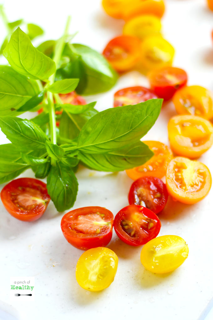 This spiralizer Greek salad is a light and refreshing side dish made with cucumbers, tomatoes, basil, chickpeas, feta cheese and balsamic vinaigrette. So easy and delicious! | APinchOfHealthy.com