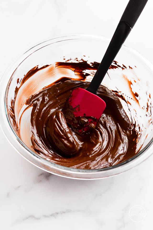 melted dark chocolate in clear glass bowl