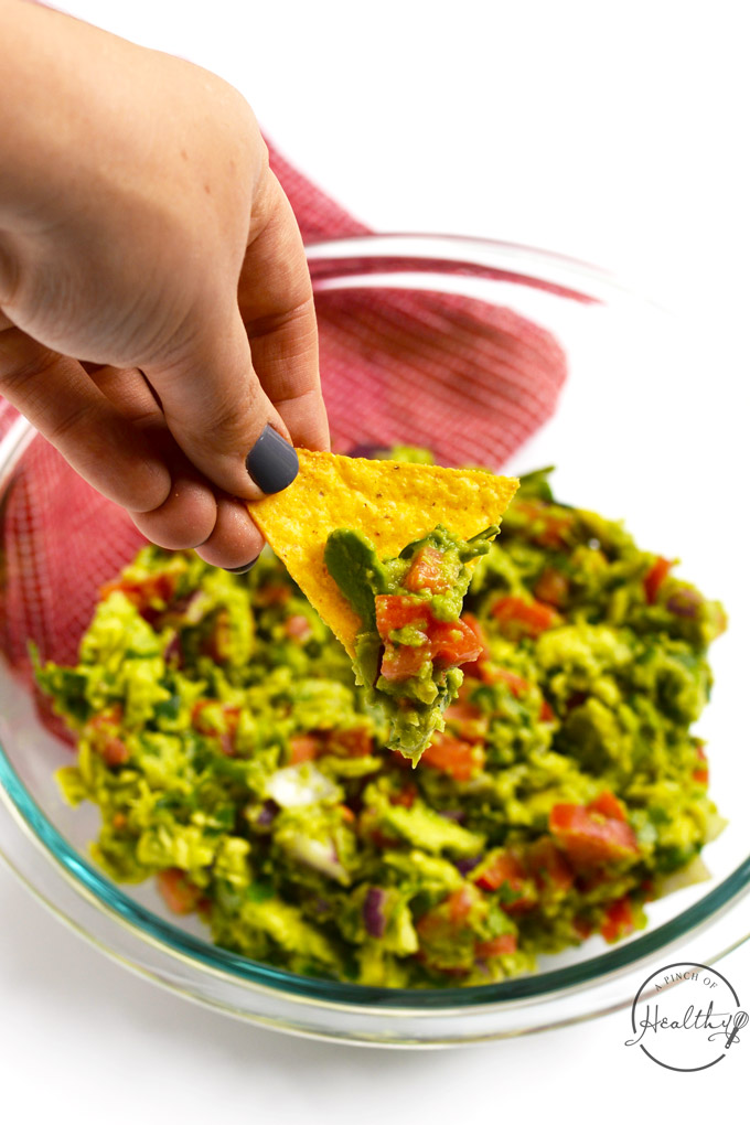 Today I am showing you how to make guacamole from scratch. My version is packed with veggies, and it is a delicious appetizer or snack. | APinchOfHealthy.com