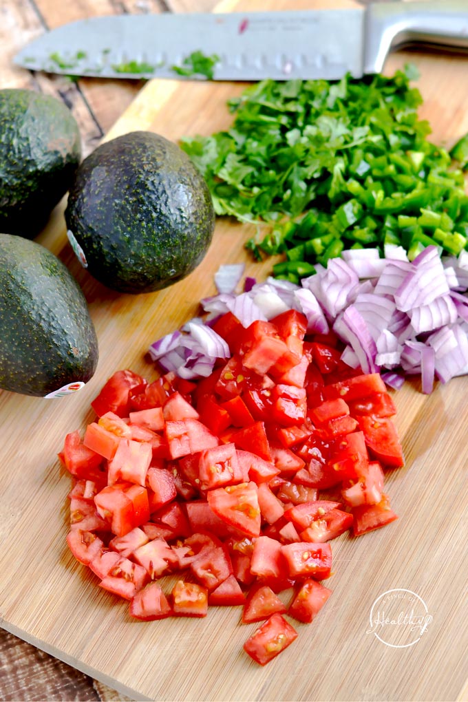 Today I am showing you how to make guacamole from scratch. My version is packed with veggies, and it is a delicious appetizer or snack. | APinchOfHealthy.com