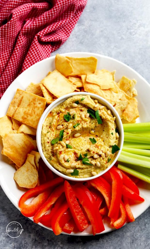 Classic hummus with red peppers celery and pita chips