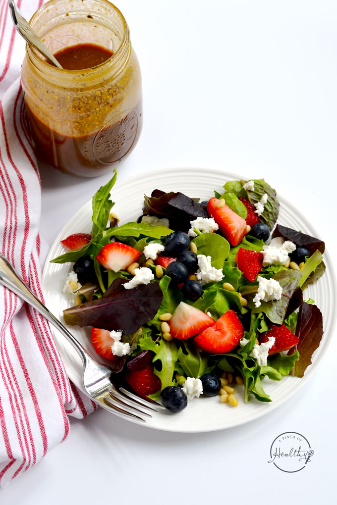 with berries, goat cheese and pine nuts