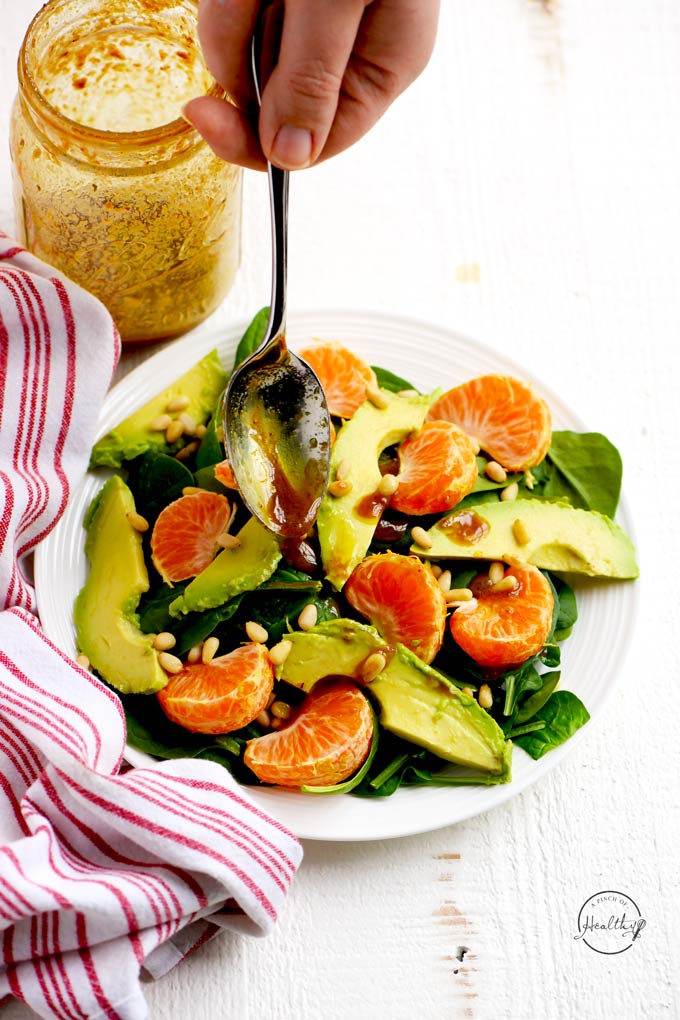 Spinach salad with mandarin oranges, avocado, pine nuts and balsamic vinaigrette