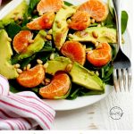 Spinach salad with mandarin oranges, avocado, pine nuts and balsamic vinaigrette