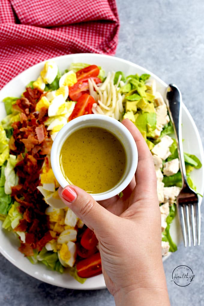 Cobb salad chicken, bacon avocado, cheese, tomatoes, eggs, lemon and olive oil