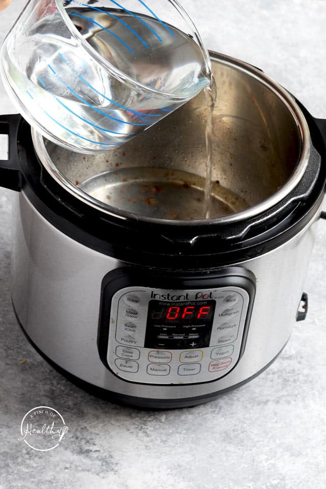 pouring water into an Instant Pot