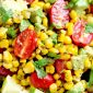 Corn salad with avocado tomato and lime dressing