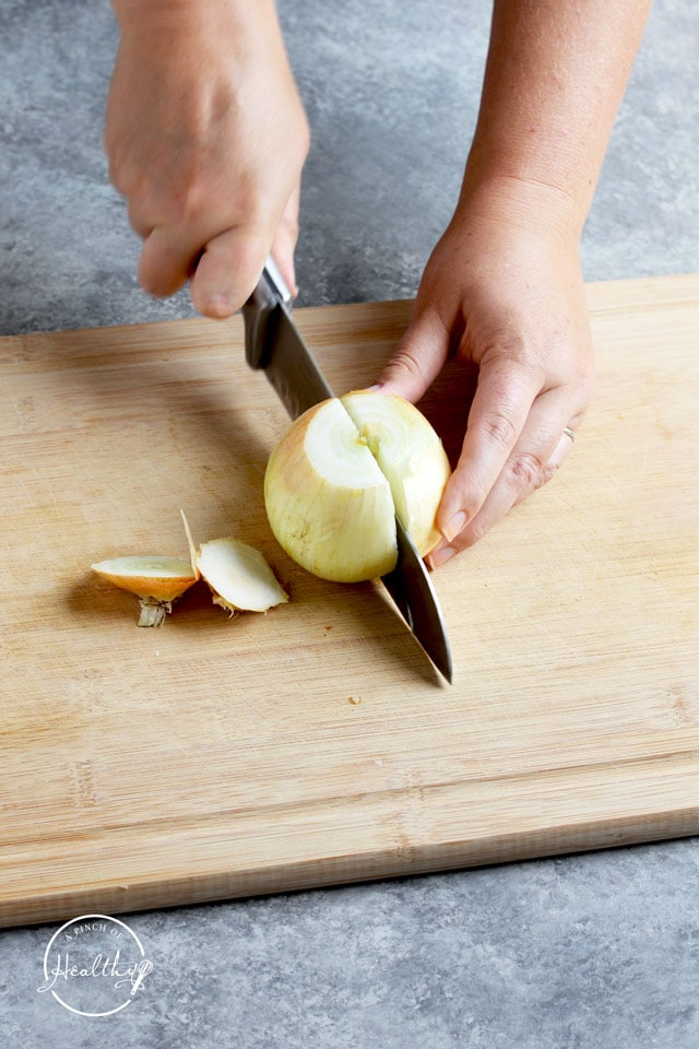 slicing onion in half