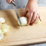 slicing onions into strips