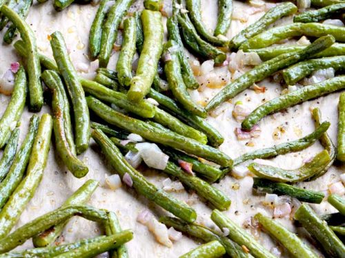 Roasted green beans on sheet pan cooked with shallots