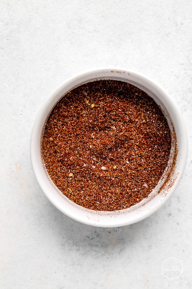 white bowl with seasoning blend on white surface