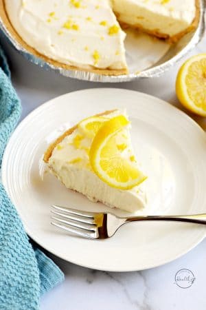 Slice of no bake lemon cheesecake on a white plate