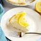Slice of no bake lemon cheesecake on a white plate