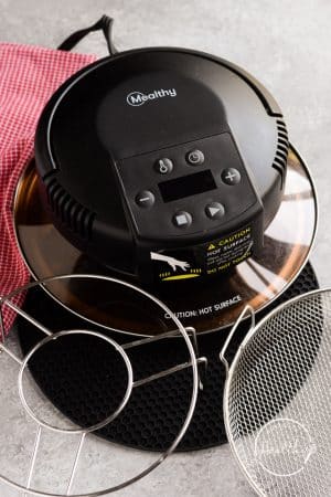 Mealthy CrispLid Review - what is included: lid, trivet, basket and silicone mat