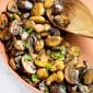 closeup sautéed mushroom in a copper pan