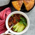 Instant pot vegetarian chili with avocado slices and cornbread
