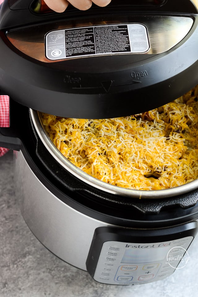 putting lid back on instant pot with pasta and cheese inside