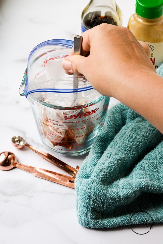 stirring marinade in freezer bag