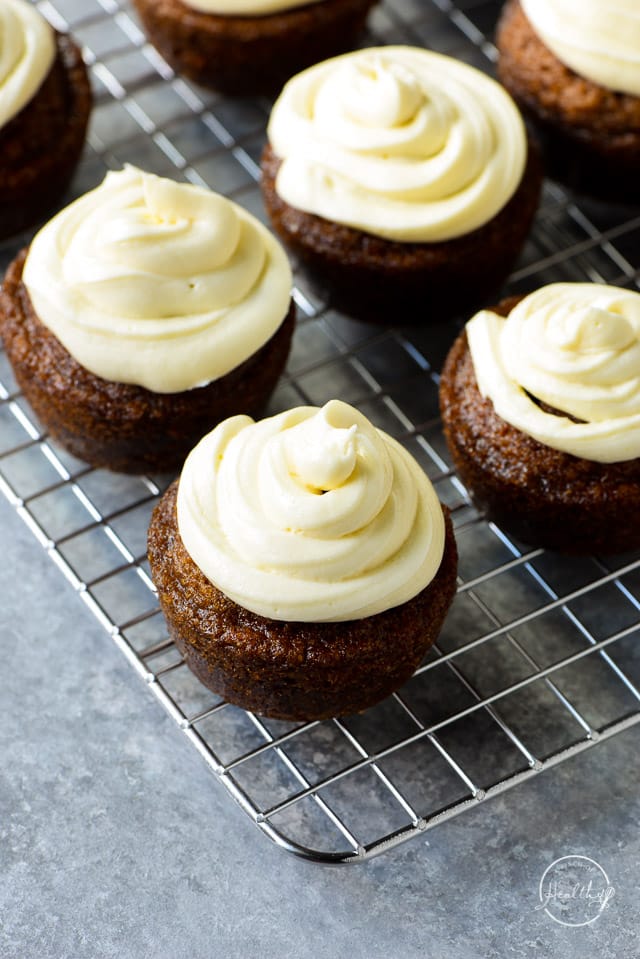carrot cakes cupcakes with swirled cream cheese icing