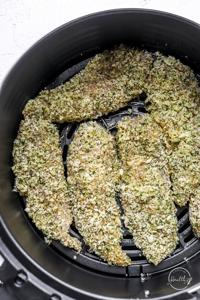 raw chicken tenders in air fryer basket