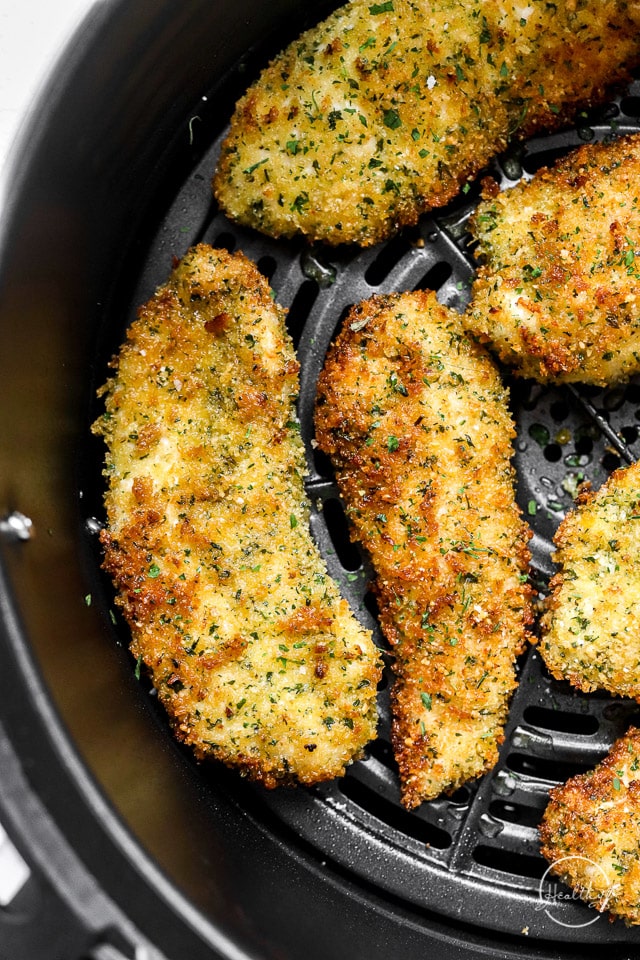Closeup air fryer chicken tenders in air fryer basket