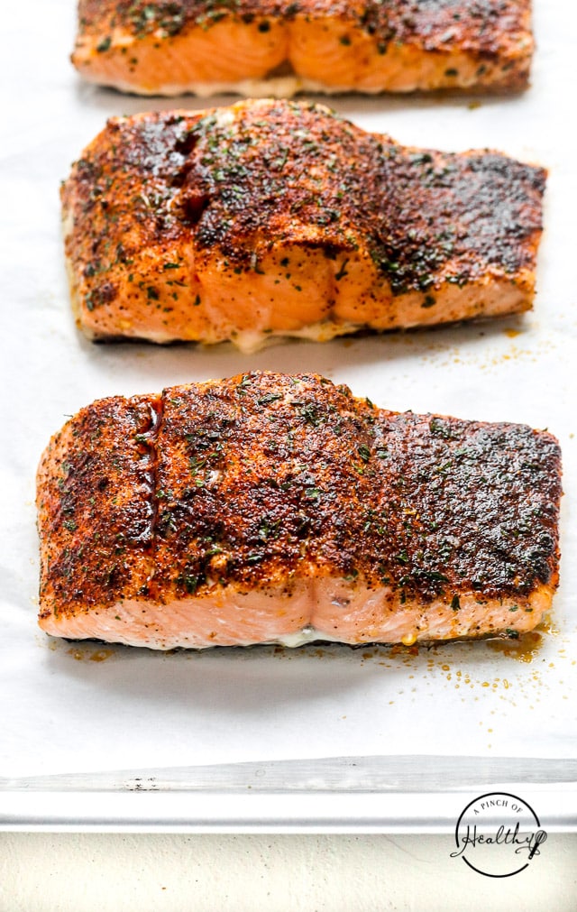 oven baked salmon on a baking sheet