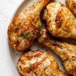 Air fryer chicken legs closeup on a white plate