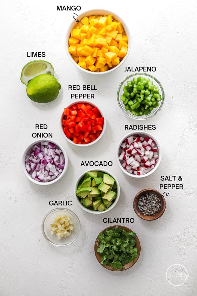 small bowls of ingredients on white surface with label text
