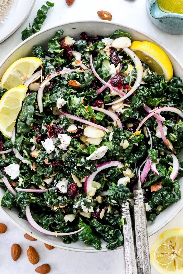 Kale salad in white serving bowl shot closeup