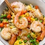 closeup of shrimp fried rice in bowl with chopsticks