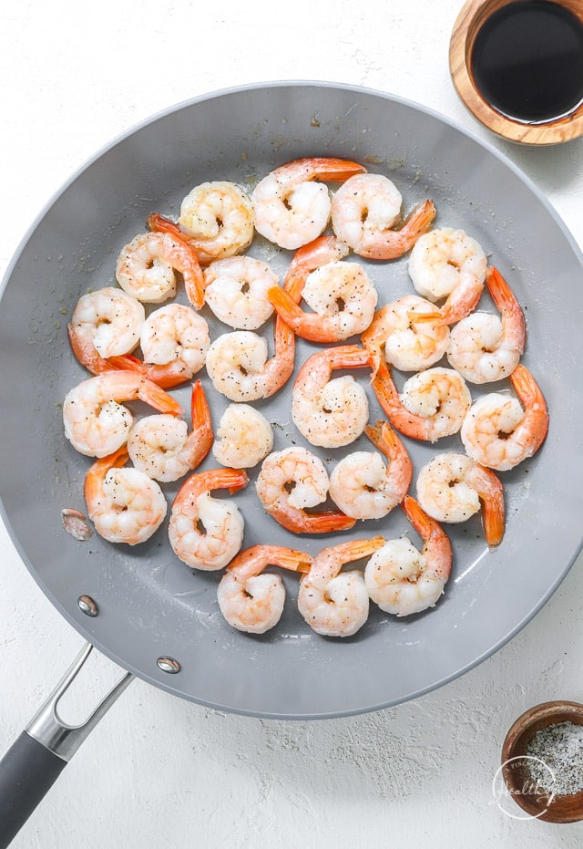 shrimp cooking in a large pan