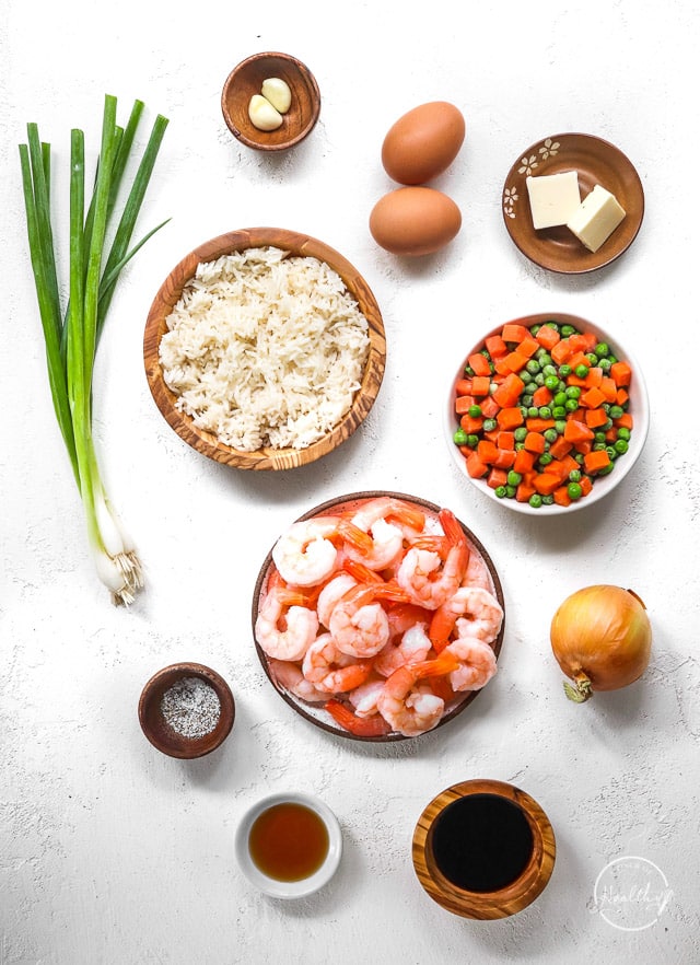ingredients in individual bowls on white surface