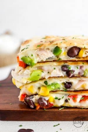 chicken quesadillas sliced and stacked on top of each other