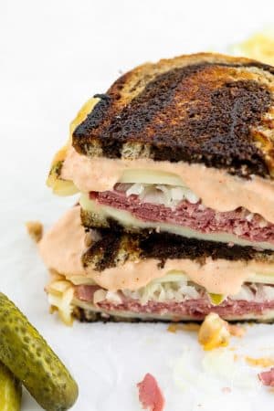 Closeup shot reuben sandwich with dripping Russian dressing