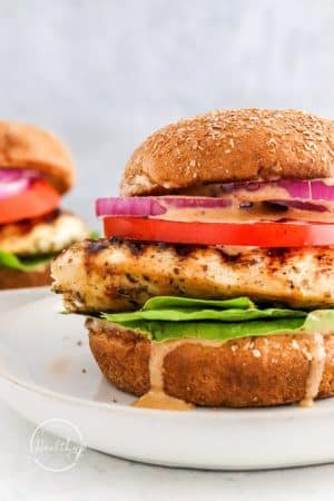Closeup shot of grilled chicken sandwich with dripping sauce
