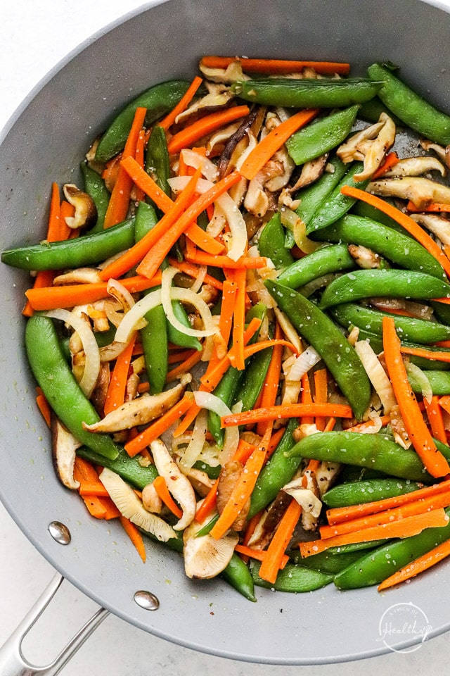 veggies cooking in a pan