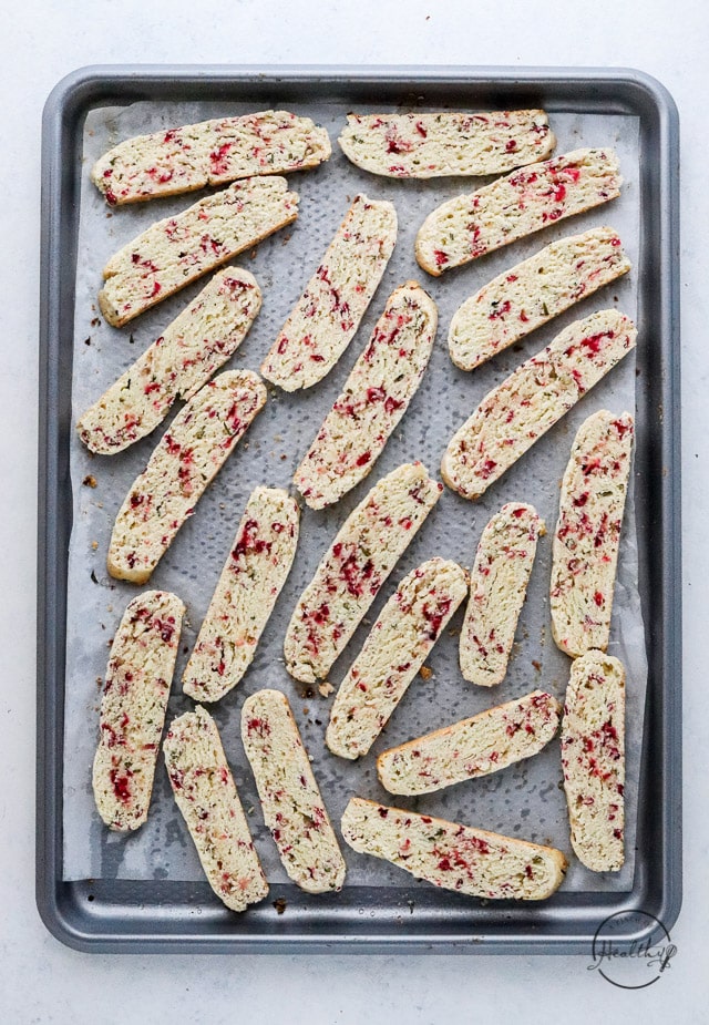 sliced Christmas biscotti on baking sheet prior to second bake