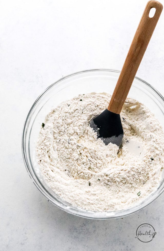 dry ingredients in a bowl with wooden spoon