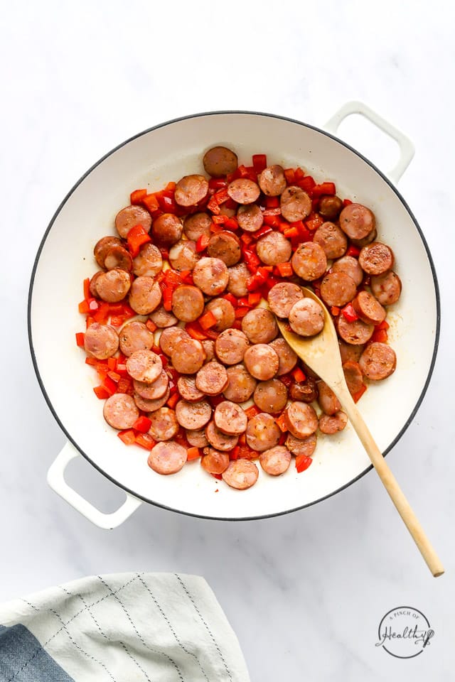 peppers and sausage in a pan