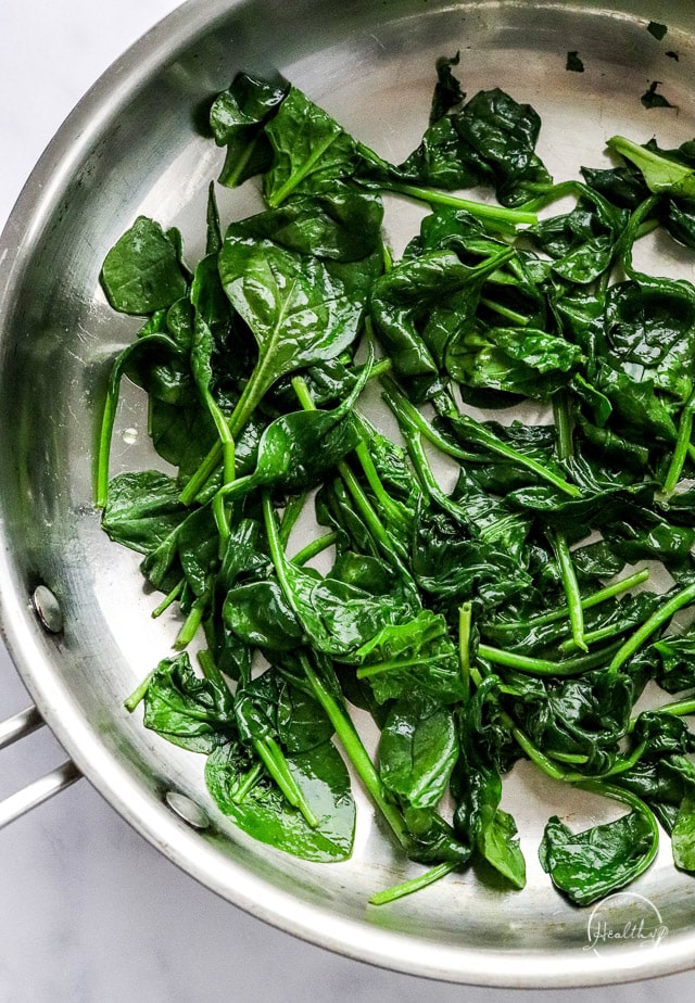 cooked spinach in a pan