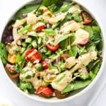 Tahini Dressing drizzled on a big salad