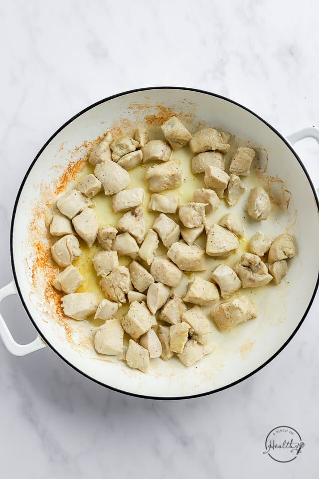 chicken cooking in a pan