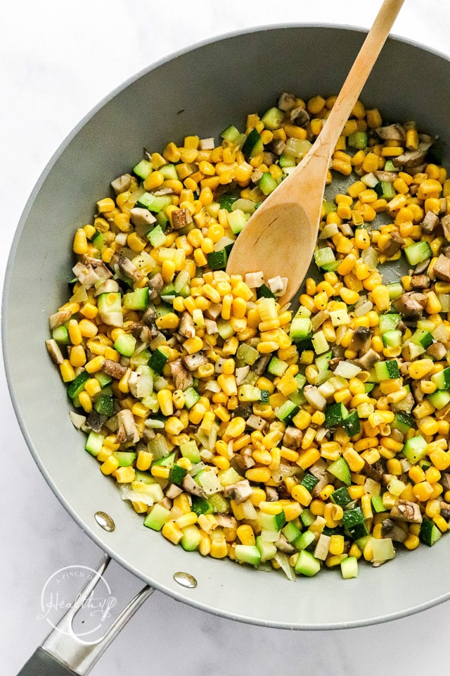 cooking veggies in a pan