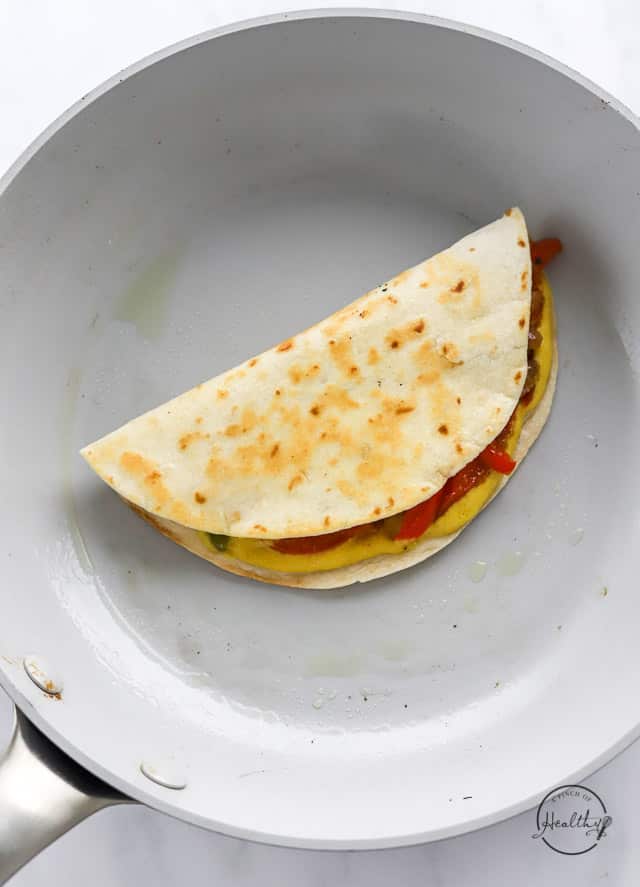 vegan quesadilla cooking in a pan