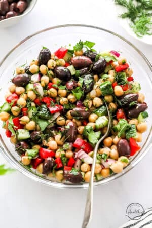 styled chickpea salad in a big bowl with spoon