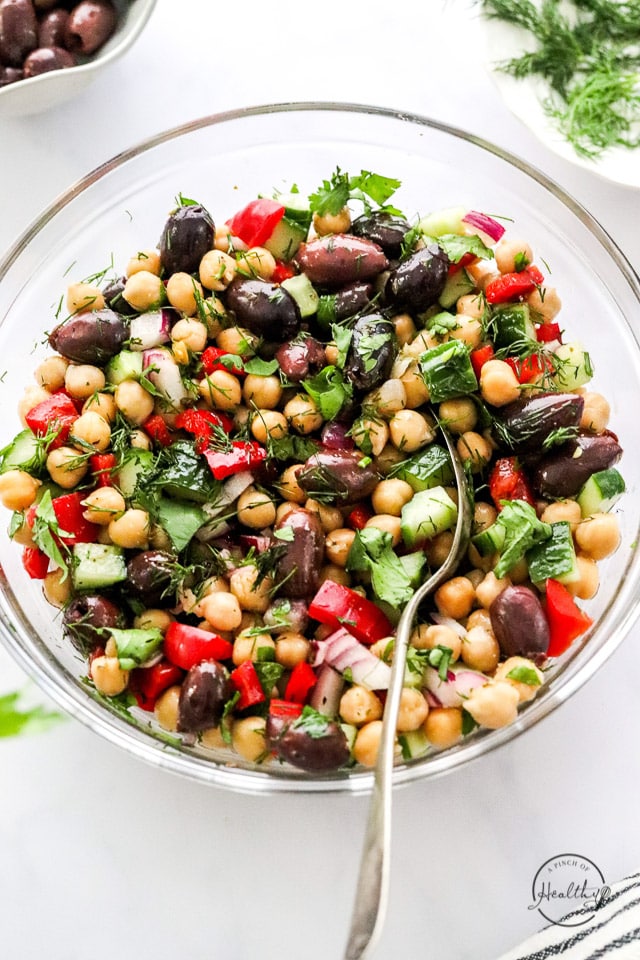 styled chickpea salad in a big bowl with spoon