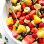 Fruit Salad Recipe made in a big serving bowl with spoon
