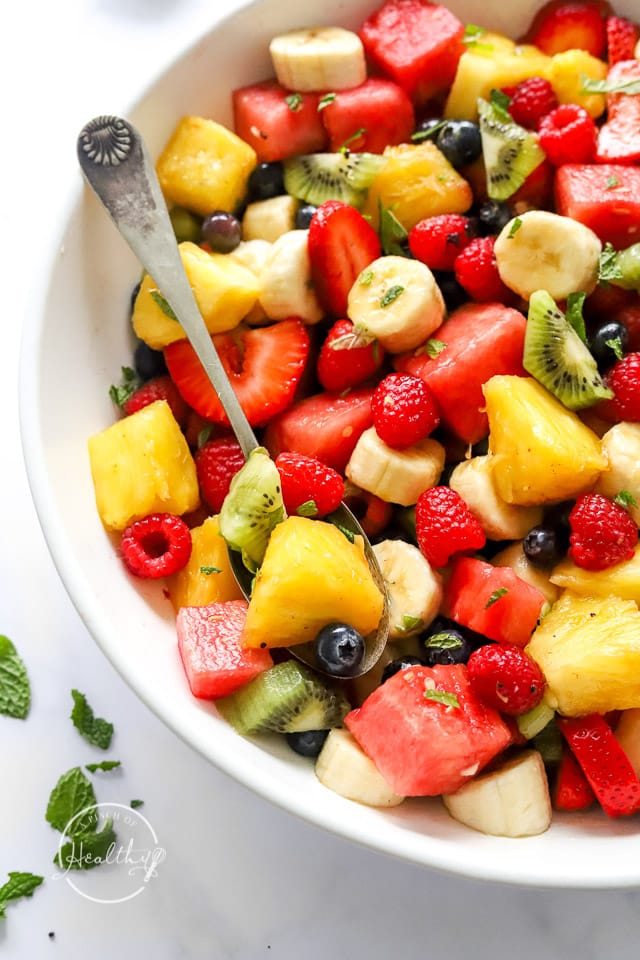 Fruit Salad Recipe made in a big serving bowl with spoon