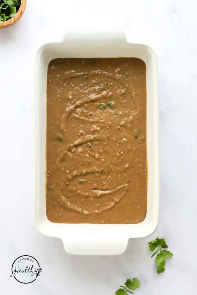 refried beans in a casserole dish
